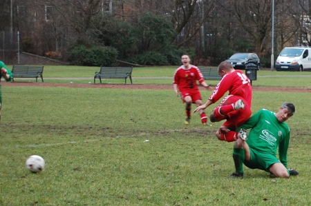 A Third Lanark player is on the receiving end of a crunching tackle.